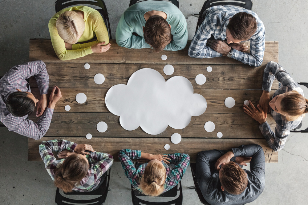 A thought bubble on a meeting table