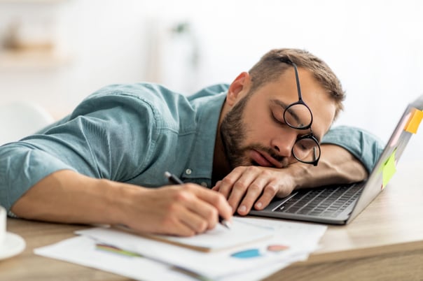 Man asleep at laptop