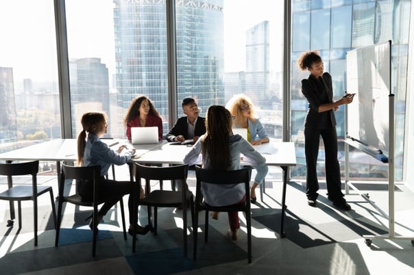 Training a team at work Shutterstock_1896248140