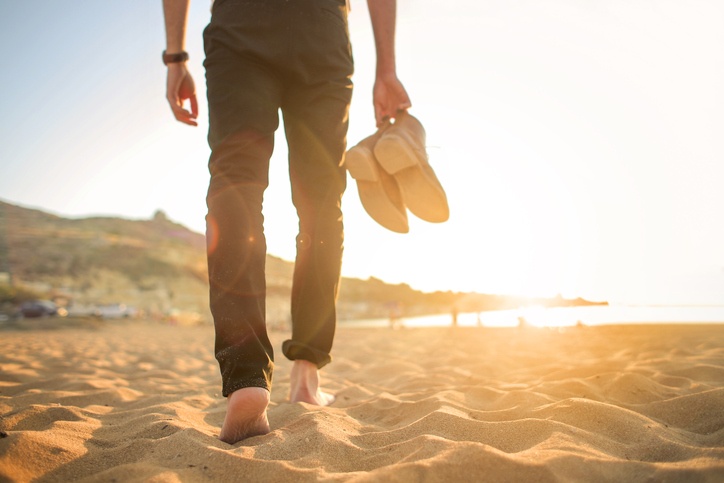 Man walking on sand