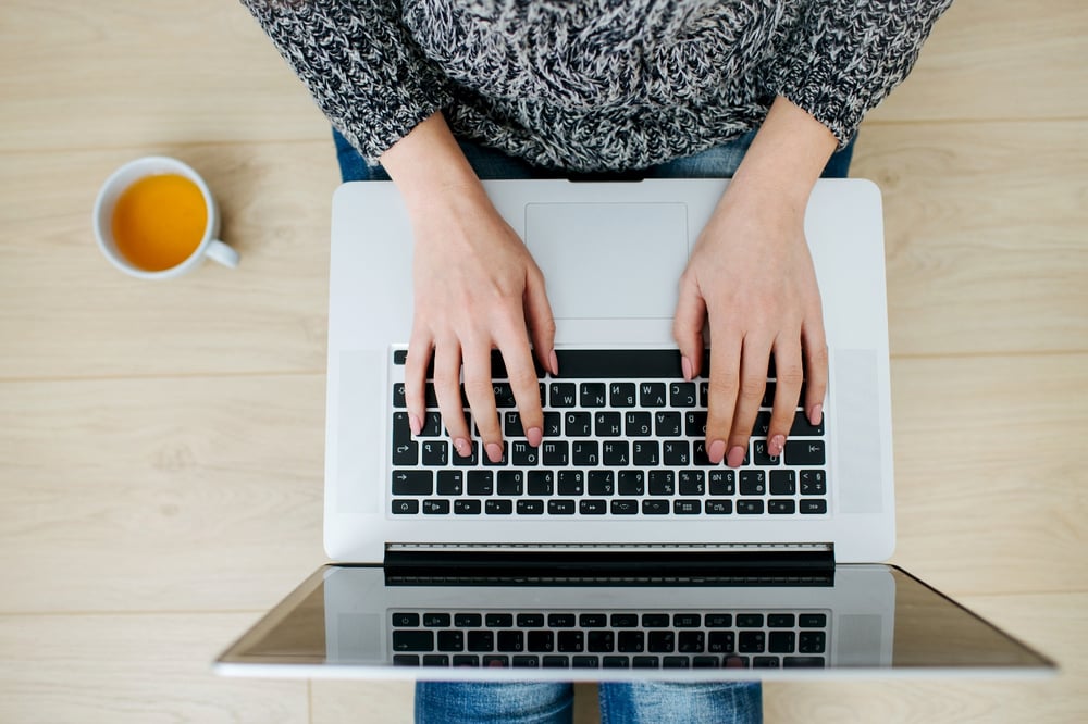 Women typing on laptop computer