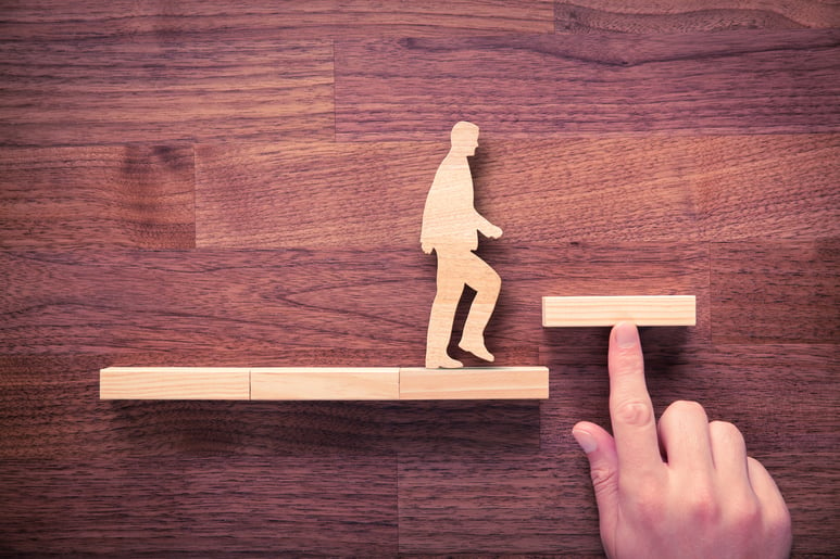 cutout person walking on block path shutterstock_461317345-1