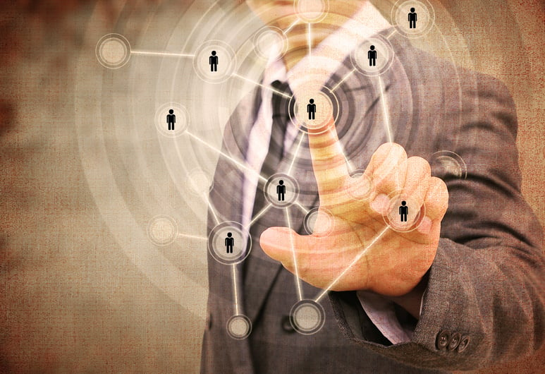 man pointing to network of people shutterstock_227931460