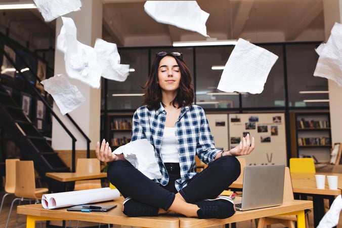 peaceful woman sitting on desk