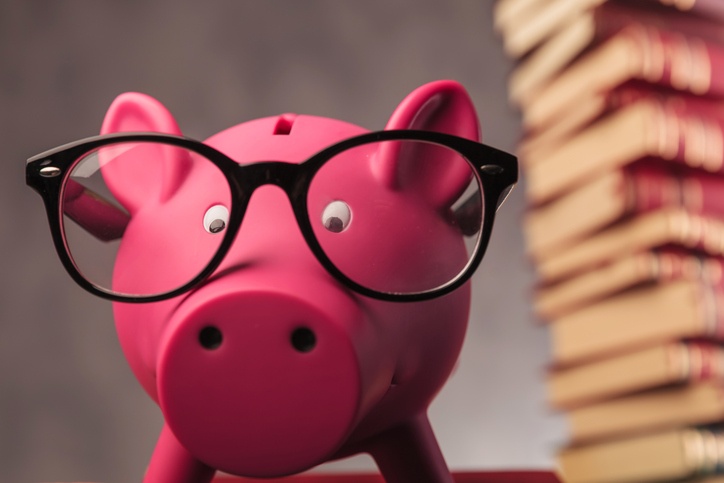 piggy bank with reading glasses 