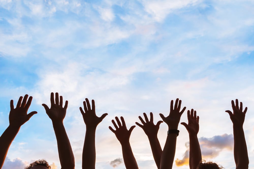 hands of happy employees