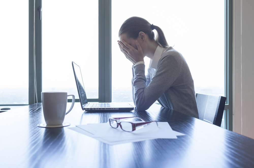 Women grieving at the desk